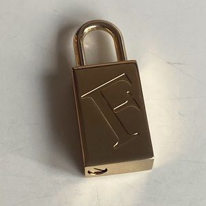 Furla bag lock gold. SOLD